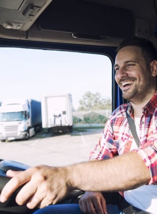 Smiling trucker - owner-operator insurance